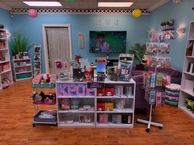 Inside the shop — albums, Sanrio, and K-pop merch on display