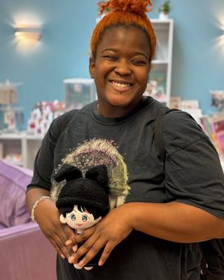 Happy customer with a K-pop plushie